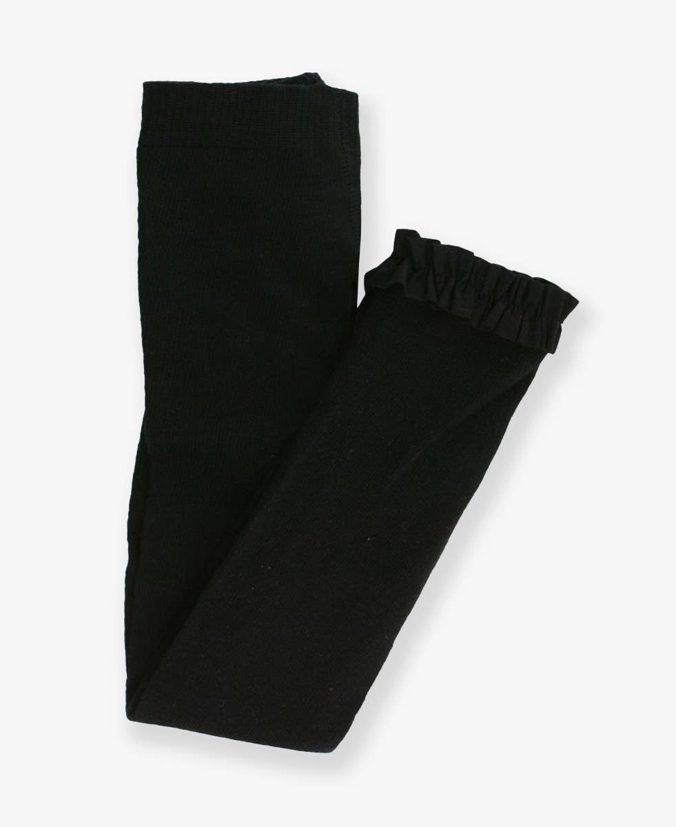 Black ruffle trimmed leggings folded on a white background