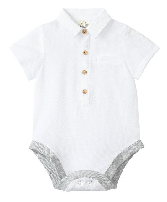 White baby onesie with short sleeves and buttons on a white background