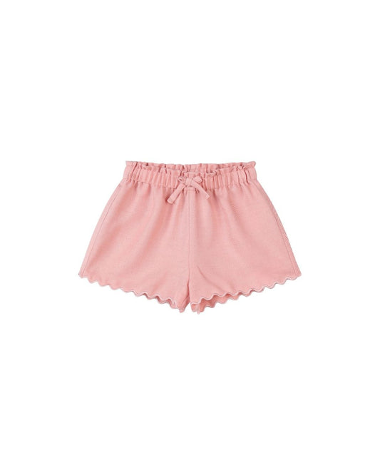 Pink shorts with scalloped hem on a white background