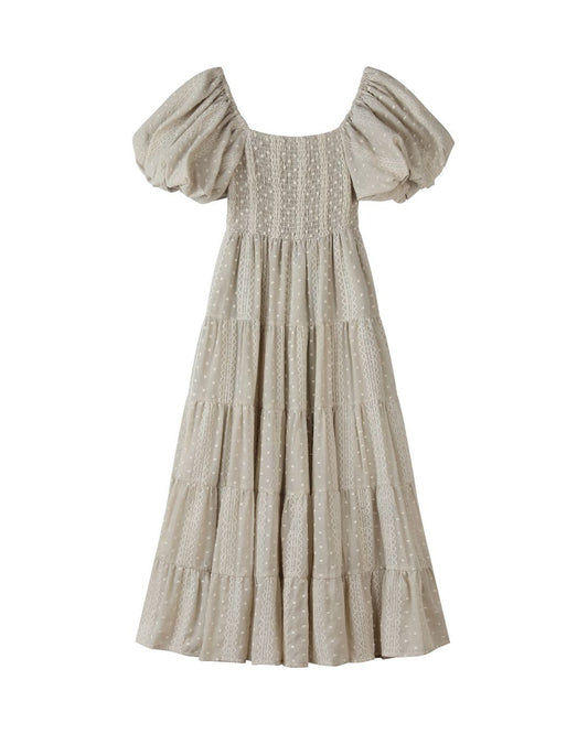taupe off-shoulder dress with smocked bodice on a white background