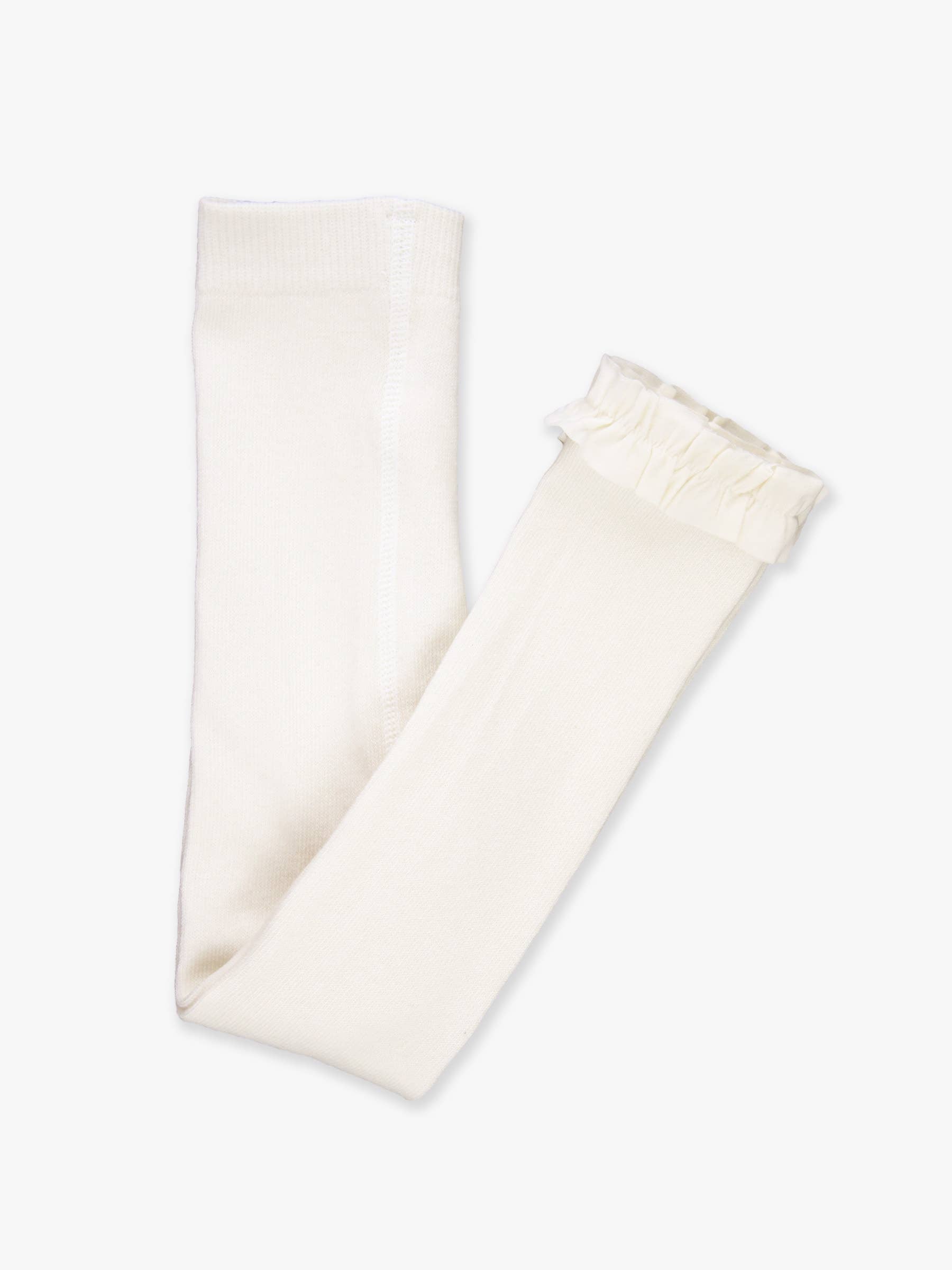 Folded cream-colored tights with ruffled cuffs on a white background